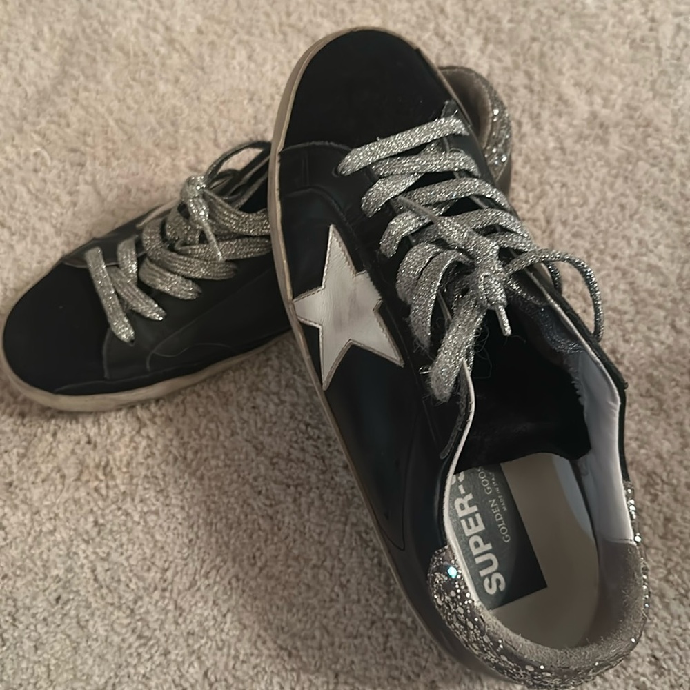 Golden Goose black athletic shoes